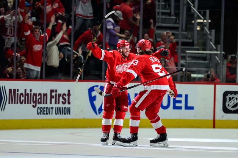 Oct 24, 2023; Detroit, Michigan, USA; Detroit Red Wings right wing Alex DeBrincat (93) celebrates with defenseman Moritz Seider (53)after scoring a power play goal against the Seattle Kraken in the third period at Little Caesars Arena. Mandatory Credit: Lon Horwedel-USA TODAY Sports