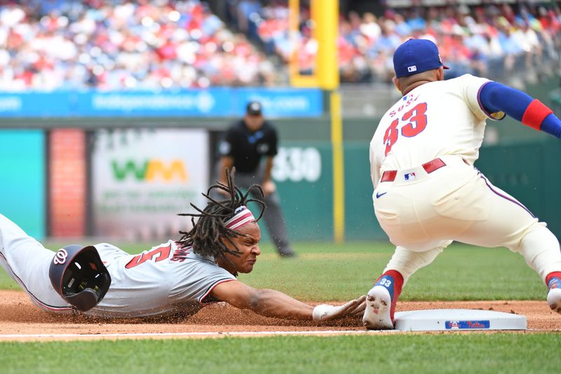 Aug 18, 2024; Philadelphia, Pennsylvania, USA; Philadelphia Phillies second base Bryson Stott (5) steals third base ahead of tag by Philadelphia Phillies shortstop Edmundo Sosa (33) during the first inning at Citizens Bank Park. Mandatory Credit: Eric Hartline-USA TODAY Sports