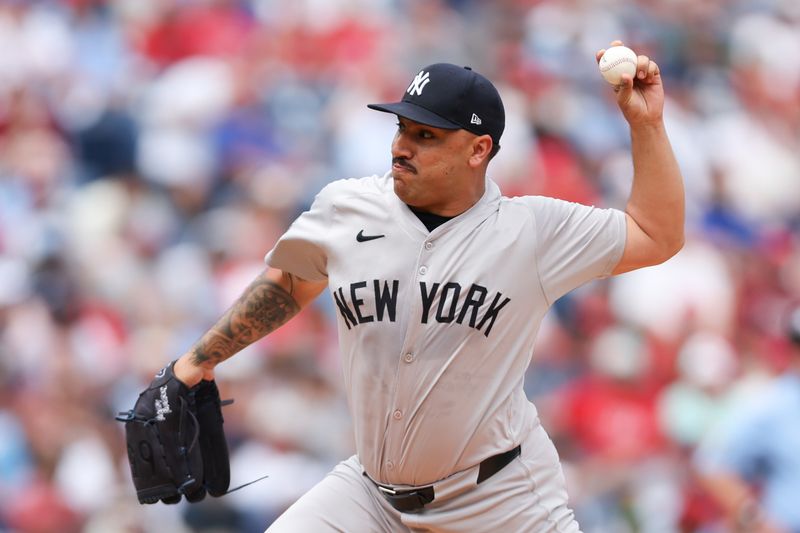 Jul 31, 2024; Philadelphia, Pennsylvania, USA;  New York Yankees pitcher Nestor Cortes (65) throws a pitch during the first inning against the Philadelphia Phillies at Citizens Bank Park. Mandatory Credit: Bill Streicher-USA TODAY Sports