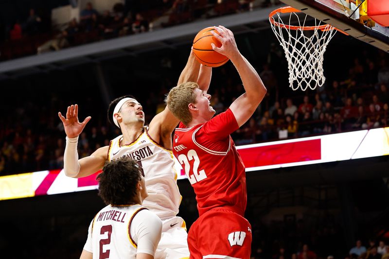 Jan 23, 2024; Minneapolis, Minnesota, USA; Minnesota Golden Gophers forward Dawson Garcia (3) blocks a shot by Wisconsin Badgers forward Steven Crowl (22) during the second half at Williams Arena. Mandatory Credit: Matt Krohn-USA TODAY Sports