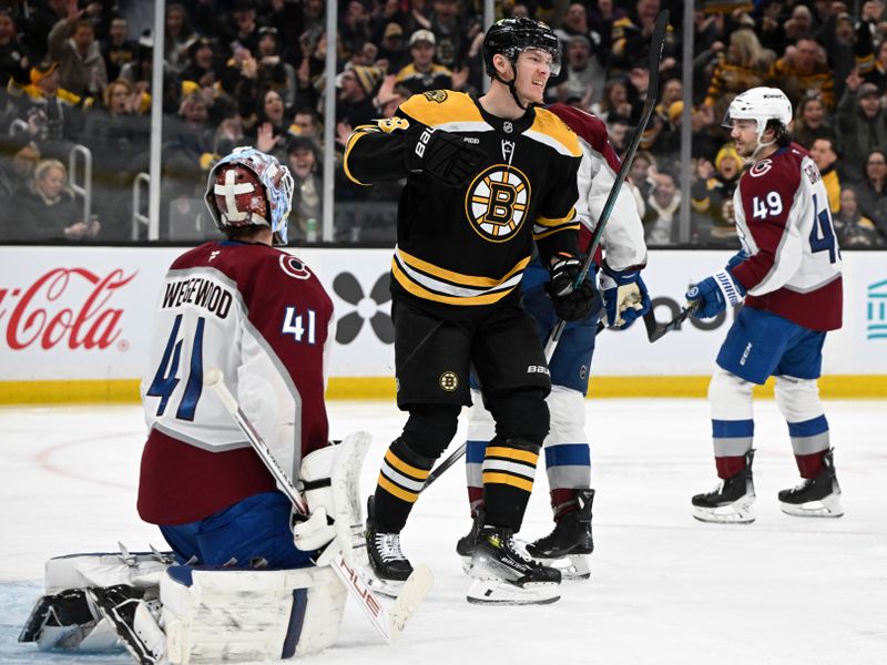 Jan 25, 2025; Boston, Massachusetts, USA; Boston Bruins center Morgan Geekie (39) reacts after scoring a goal on Colorado Avalanche goaltender Scott Wedgewood (41) during the third period at the TD Garden. Mandatory Credit: Brian Fluharty-Imagn Images