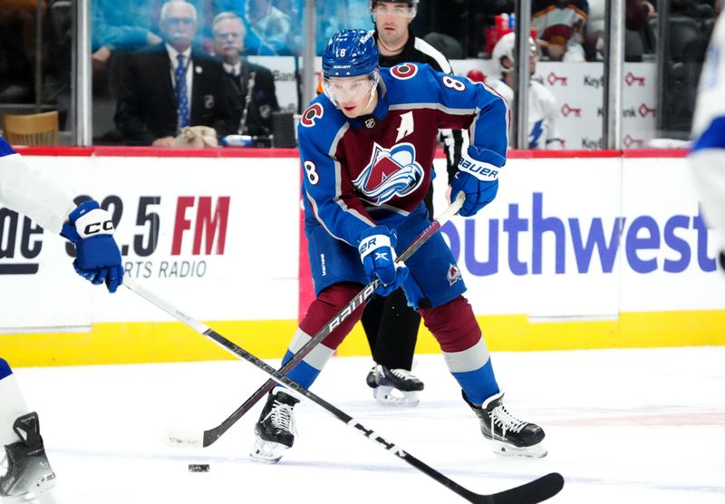 Nov 27, 2023; Denver, Colorado, USA; Colorado Avalanche defenseman Cale Makar (8) controls the puck in the second period against the Tampa Bay Lightning at Ball Arena. Mandatory Credit: Ron Chenoy-USA TODAY Sports