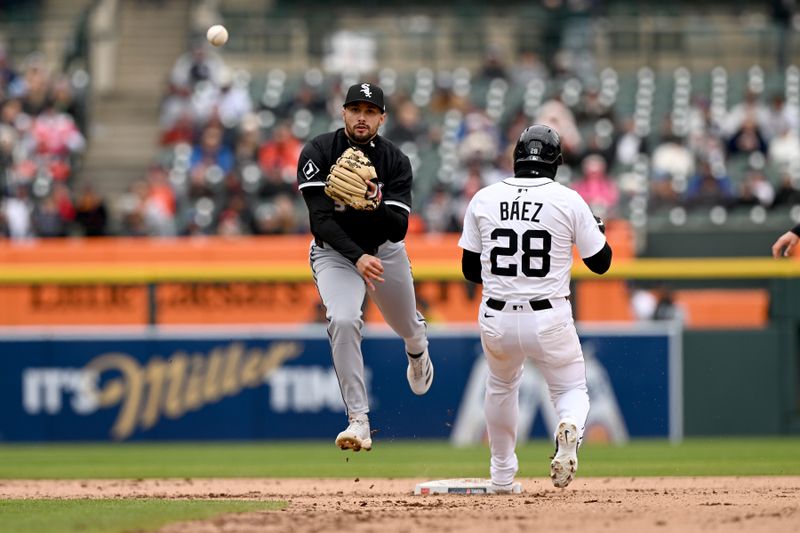 Apr 6, 2025; Detroit, Michigan, USA;  Chicago White Sox shortstop Jacob Amaya (8) tries to turn a couple play over Detroit Tigers shortstop Javier Báez (28) in the eighth inning at Comerica Park. Mandatory Credit: Lon Horwedel-Imagn Images