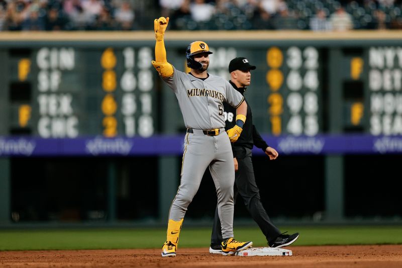 Apr 9, 2025; Denver, Colorado, USA; Milwaukee Brewers center fielder Garrett Mitchell (5) reacts after hitting a double in the third inning against the Colorado Rockies at Coors Field. Mandatory Credit: Isaiah J. Downing-Imagn Images