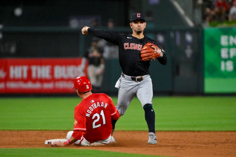 Sep 20, 2024; St. Louis, Missouri, USA;  Cleveland Guardians second baseman Andres Gimenez (0) forces out St. Louis Cardinals center fielder Lars Nootbaar (21) and throws to first to complete the double play during the ninth inning at Busch Stadium. Mandatory Credit: Jeff Curry-Imagn Images