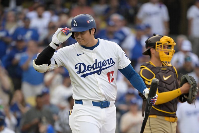 Oct 11, 2024; Los Angeles, California, USA; Los Angeles Dodgers designated hitter Shohei Ohtani (17) reacts at bat in the first inning against the San Diego Padres during game five of the NLDS for the 2024 MLB Playoffs at Dodger Stadium. Mandatory Credit: Jayne Kamin-Oncea-Imagn Images