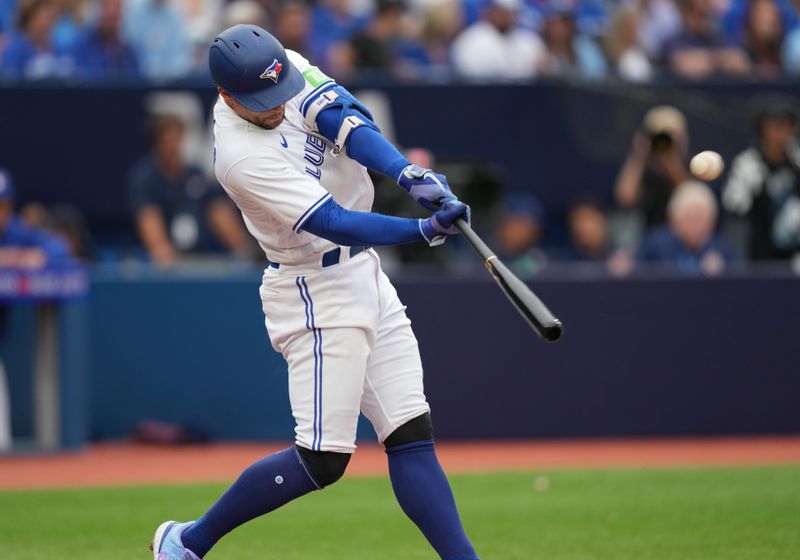 Sep 9, 2023; Toronto, Ontario, CAN; Toronto Blue Jays right fielder George Springer (4) hits a home run against the Kansas City Royals during the seventh inning at Rogers Centre. Mandatory Credit: Nick Turchiaro-USA TODAY Sports