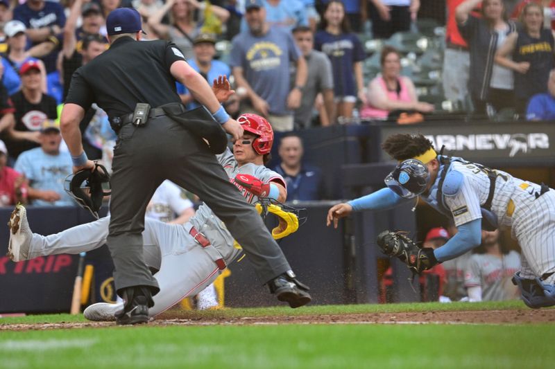 Jun 16, 2024; Milwaukee, Wisconsin, USA; Cincinnati Reds center fielder Stuart Fairchild (17) is tagged out by Milwaukee Brewers  catcher William Contreras (24) in the ninth inning at American Family Field. Mandatory Credit: Benny Sieu-USA TODAY Sports