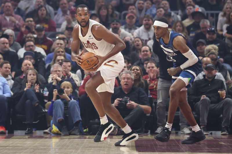 CLEVELAND, OH - FEBRUARY 10:  Evan Mobley #4 of the Cleveland Cavaliers handles the ball during the game against the Minnesota Timberwolves on February 10, 2025 at Rocket Mortgage FieldHouse in Cleveland, Ohio. NOTE TO USER: User expressly acknowledges and agrees that, by downloading and/or using this Photograph, user is consenting to the terms and conditions of the Getty Images License Agreement. Mandatory Copyright Notice: Copyright 2025 NBAE (Photo by  Lauren Leigh Bacho/NBAE via Getty Images)