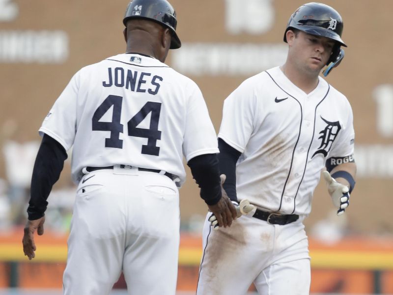 Jun 9, 2023; Detroit, Michigan, USA; Detroit Tigers catcher Jake Rogers (34) high-fives third base coach Gary Jones after his home run during the game against the Arizona Diamondbacks at Comerica Park. Mandatory Credit: Brian Bradshaw Sevald-USA TODAY Sports