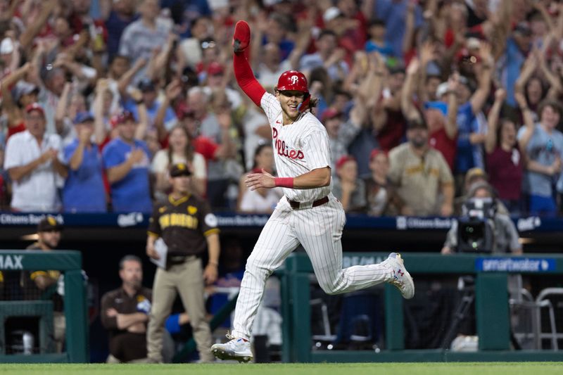 Jun 18, 2024; Philadelphia, Pennsylvania, USA; Philadelphia Phillies third base Alec Bohm (28) reacts as he runs home to score the game winning run during the ninth inning against the San Diego Padres at Citizens Bank Park. Mandatory Credit: Bill Streicher-USA TODAY Sports