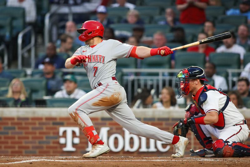 Apr 11, 2023; Atlanta, Georgia, USA; Cincinnati Reds third baseman Spencer Steer (7) hits a two-RBI single against the Atlanta Braves in the third inning at Truist Park. Mandatory Credit: Brett Davis-USA TODAY Sports