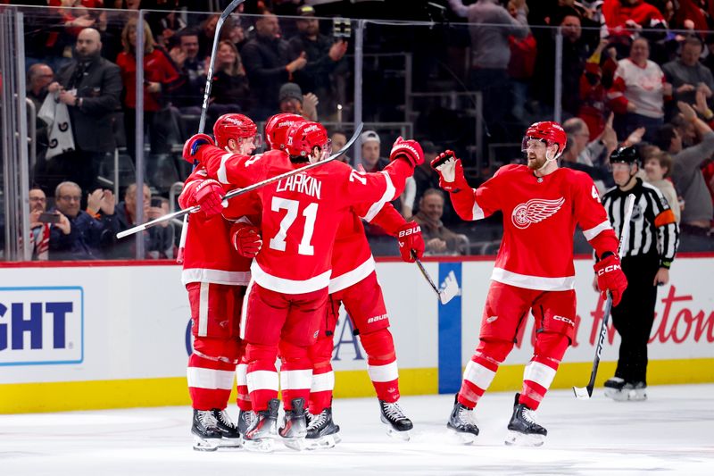 Jan 31, 2024; Detroit, Michigan, USA;  Detroit Red Wings center Dylan Larkin (71) receives congratulations from teammates after scoring in the third period against the Ottawa Senators at Little Caesars Arena. Mandatory Credit: Rick Osentoski-USA TODAY Sports