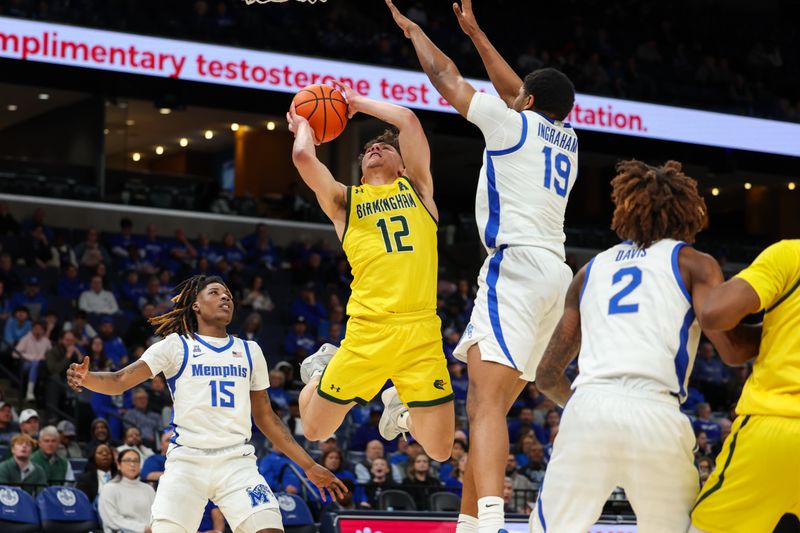 Feb 22, 2026; Memphis, Tennessee, USA; UAB Blazers guard Jacob Meyer (12) shoots the ball against Memphis Tigers forward Tariq Ingraham (19) during the second half at FedExForum. Mandatory Credit: Wesley Hale-Imagn Images