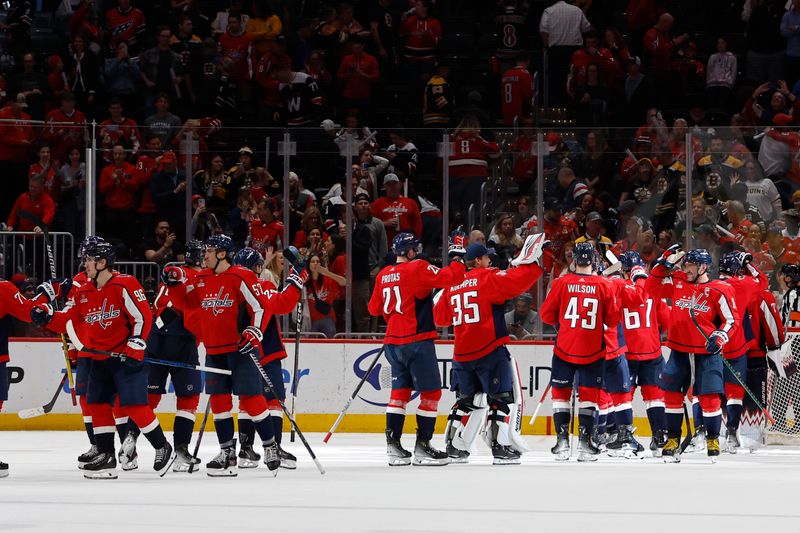 Apr 15, 2024; Washington, District of Columbia, USA; Washington Capitals players celebrate after their game against the Boston Bruins at Capital One Arena. Mandatory Credit: Geoff Burke-USA TODAY Sports