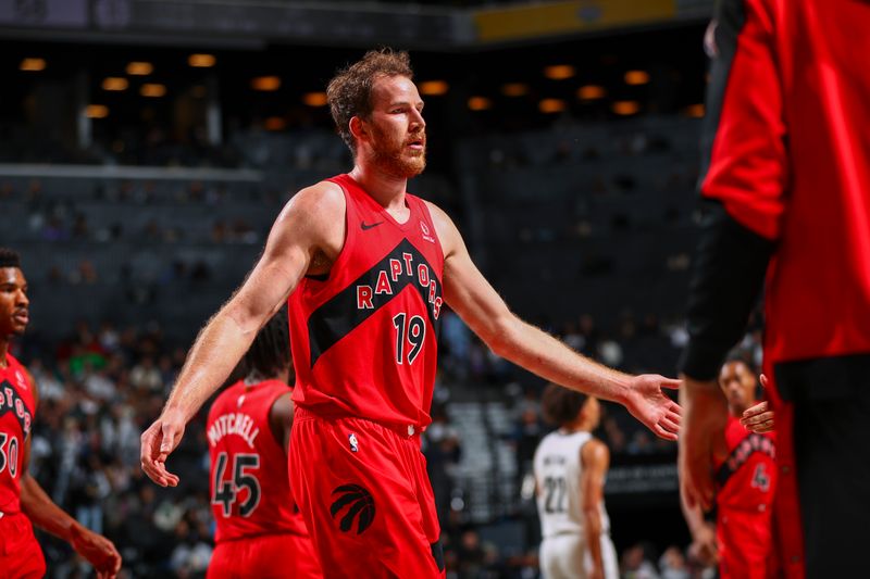 BROOKLYN, NY - OCTOBER 18: Jakob Poeltl #19 of the Toronto Raptors looks on during the game on October 18, 2024 at Barclays Center in Brooklyn, New York. NOTE TO USER: User expressly acknowledges and agrees that, by downloading and or using this Photograph, user is consenting to the terms and conditions of the Getty Images License Agreement. Mandatory Copyright Notice: Copyright 2024 NBAE (Photo by David L. Nemec/NBAE via Getty Images)