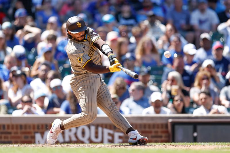 May 8, 2024; Chicago, Illinois, USA; San Diego Padres catcher Luis Campusano (12) singles against the Chicago Cubs during the fifth inning at Wrigley Field. Mandatory Credit: Kamil Krzaczynski-USA TODAY Sports