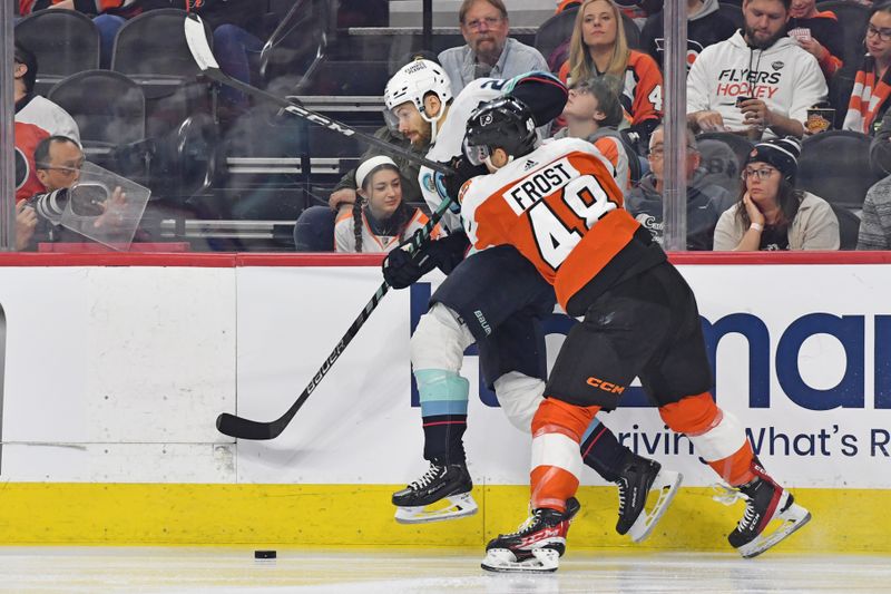 Feb 10, 2024; Philadelphia, Pennsylvania, USA; Philadelphia Flyers center Morgan Frost (48) checks Seattle Kraken right wing Oliver Bjorkstrand (22) during the second period at Wells Fargo Center. Mandatory Credit: Eric Hartline-USA TODAY Sports