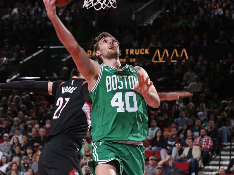 PORTLAND, OR - MARCH 17: Luke Kornet #40 of the Boston Celtics drives to the basket during the game against the Portland Trail Blazers on March 17, 2023 at the Moda Center Arena in Portland, Oregon. NOTE TO USER: User expressly acknowledges and agrees that, by downloading and or using this photograph, user is consenting to the terms and conditions of the Getty Images License Agreement. Mandatory Copyright Notice: Copyright 2023 NBAE (Photo by Cameron Browne/NBAE via Getty Images)