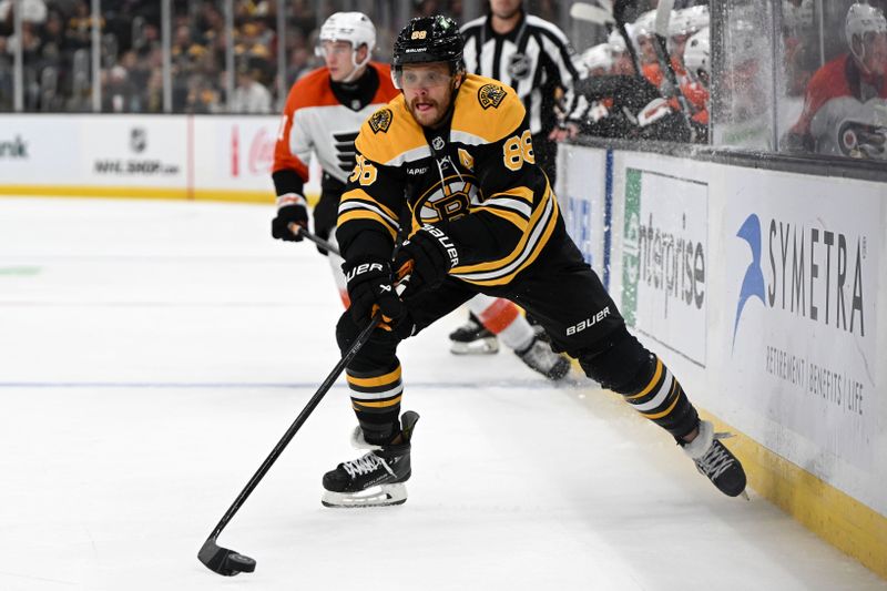 Oct 1, 2024; Boston, Massachusetts, USA; Boston Bruins right wing David Pastrnak (88) clears the puck during the second period of a game against the Philadelphia Flyers at the TD Garden. Mandatory Credit: Brian Fluharty-Imagn Images