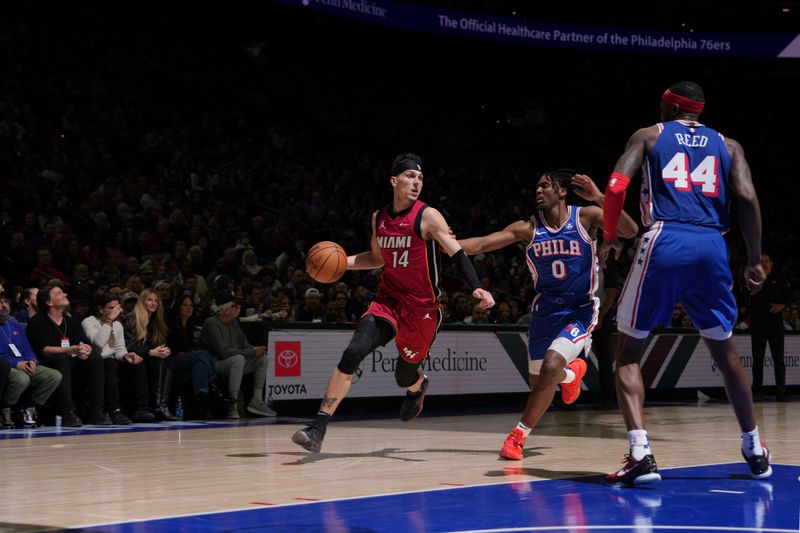 PHILADELPHIA, PA - FEBRUARY 14: Tyler Herro #14 of the Miami Heat dribbles the ball during the game against the Philadelphia 76ers on February 14, 2024 at the Wells Fargo Center in Philadelphia, Pennsylvania NOTE TO USER: User expressly acknowledges and agrees that, by downloading and/or using this Photograph, user is consenting to the terms and conditions of the Getty Images License Agreement. Mandatory Copyright Notice: Copyright 2024 NBAE (Photo by Jesse D. Garrabrant/NBAE via Getty Images)