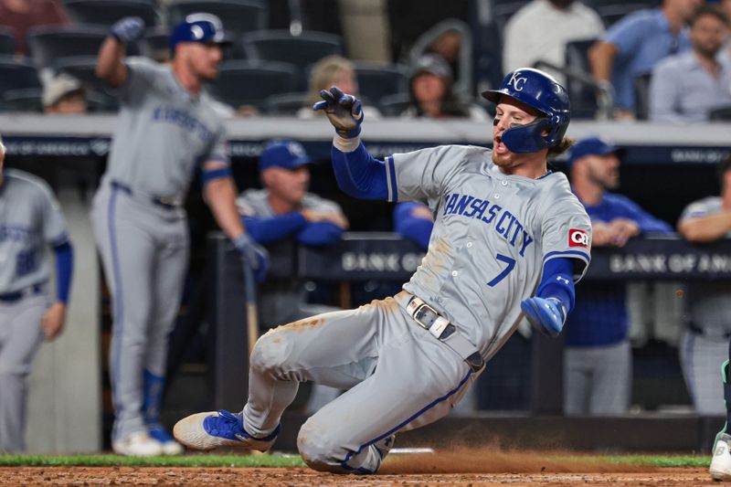 Sep 10, 2024; Bronx, New York, USA; Kansas City Royals shortstop Bobby Witt Jr. (7) scores a run on an RBI single by catcher Salvador Perez (not pictured) during the third inning against the New York Yankees at Yankee Stadium. Mandatory Credit: Vincent Carchietta-Imagn Images