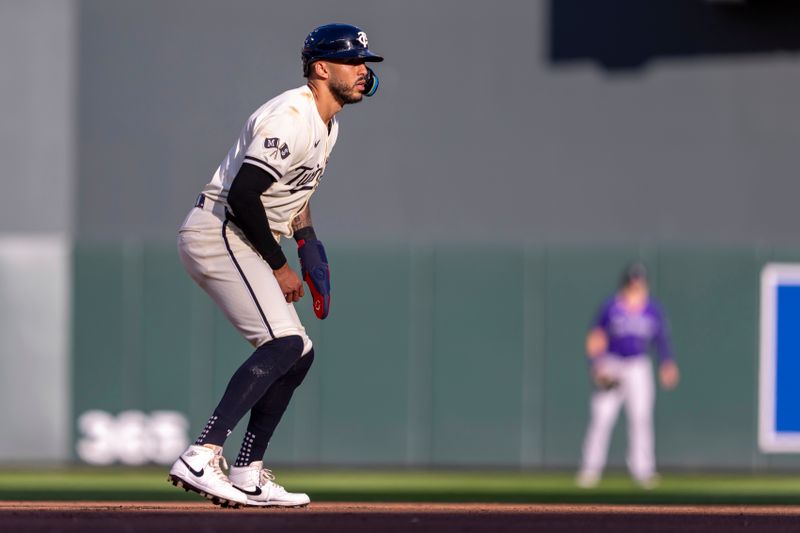 Jun 11, 2024; Minneapolis, Minnesota, USA; Minnesota Twins shortstop Carlos Correa (4) looks on from second base against the Colorado Rockies in the first inning at Target Field. Mandatory Credit: Jesse Johnson-USA TODAY Sports