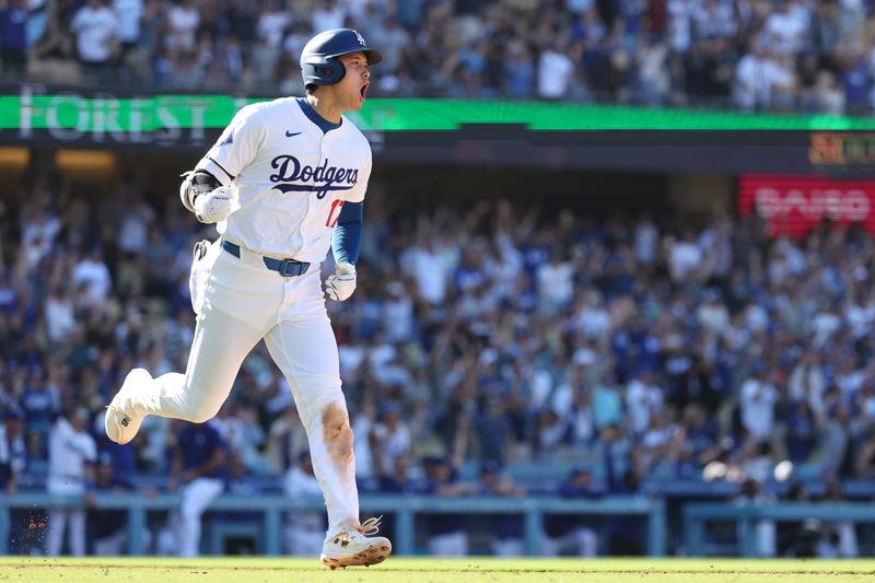 Sep 22, 2024; Los Angeles, California, USA;  Los Angeles Dodgers designated hitter Shohei Ohtani (17) celebrates on a game tying solo home run during the ninth inning against the Colorado Rockies at Dodger Stadium. Mandatory Credit: Kiyoshi Mio-Imagn Images