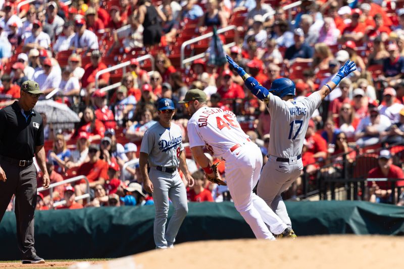 May 21, 2023; St. Louis, Missouri, USA;  Los Angeles Dodgers Vargas (17) ruled out after official review by the St. Louis Cardinals at Busch Stadium. Mandatory Credit: Zach Dalin-USA TODAY Sports