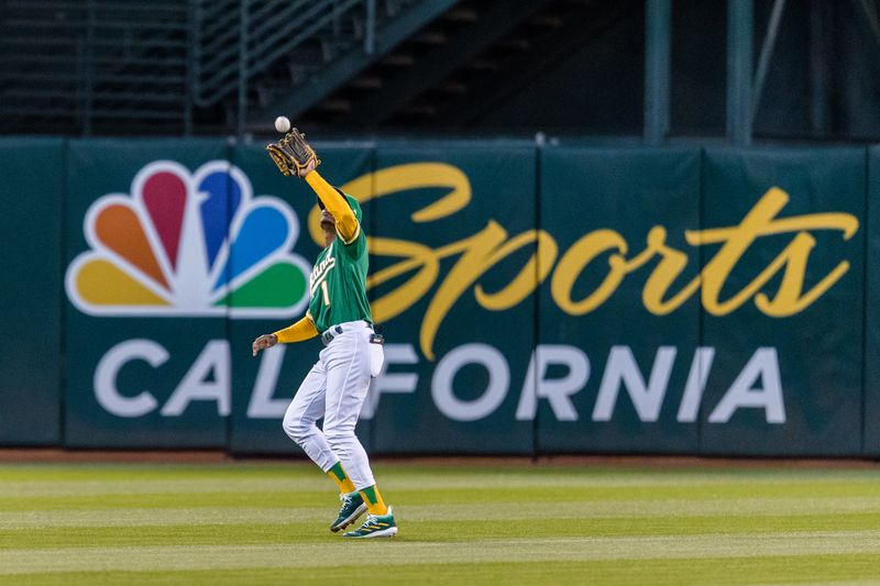 Apr 18, 2023; Oakland, California, USA; Oakland Athletics center fielder Esteury Ruiz (1) catches a fly ball against the Chicago Cubs uring the fourth inning at RingCentral Coliseum. Mandatory Credit: John Hefti-USA TODAY Sports