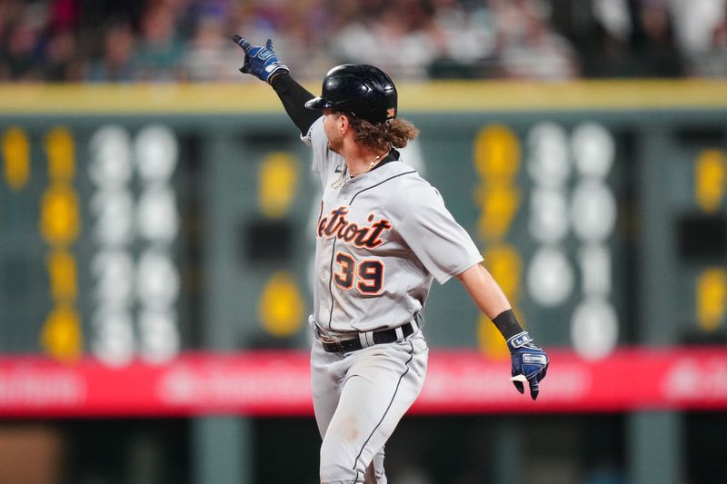 Jul 1, 2023; Denver, Colorado, USA; Detroit Tigers left fielder Zach McKinstry (39) celebrates his three run home run in the tenth inning against the Colorado Rockies at Coors Field. Mandatory Credit: Ron Chenoy-USA TODAY Sports