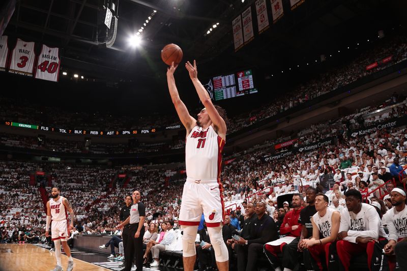 MIAMI, FL - APRIL 27: Jaime Jaquez Jr. #11 of the Miami Heat shoots a three point basket during the game against the Boston Celtics during Round 1 Game 3 of the 2024 NBA Playoffs on April 27, 2024 at Kaseya Center in Miami, Florida. NOTE TO USER: User expressly acknowledges and agrees that, by downloading and or using this Photograph, user is consenting to the terms and conditions of the Getty Images License Agreement. Mandatory Copyright Notice: Copyright 2024 NBAE (Photo by Issac Baldizon/NBAE via Getty Images)