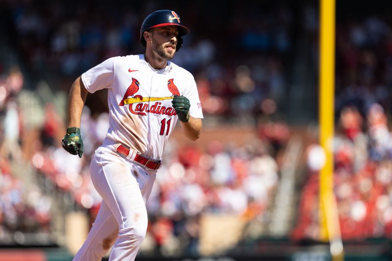 May 21, 2023; St. Louis, Missouri, USA;  St. Louis Cardinals Paul DeJong (11) hits a home run in the seventh inning at Busch Stadium against the Los Angeles Dodgers. Mandatory Credit: Zach Dalin-USA TODAY Sports