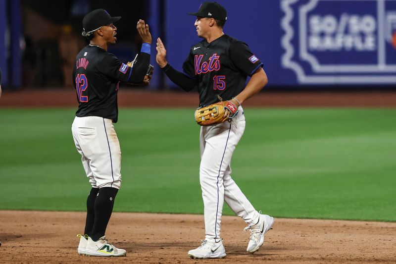 Jun 28, 2024; New York City, New York, USA;  New York Mets shortstop Francisco Lindor (12) and right fielder Tyrone Taylor (15) celebrate after defeating the Houston Astros 7-2 at Citi Field. Mandatory Credit: Wendell Cruz-USA TODAY Sports