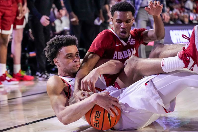 Jan 31, 2024; Athens, Georgia, USA; Georgia Bulldogs guard Jabri Abdur-Rahim (1) and Alabama Crimson Tide guard Rylan Griffen (3) fight for the ball during the second half at Stegeman Coliseum. Mandatory Credit: Dale Zanine-USA TODAY Sports