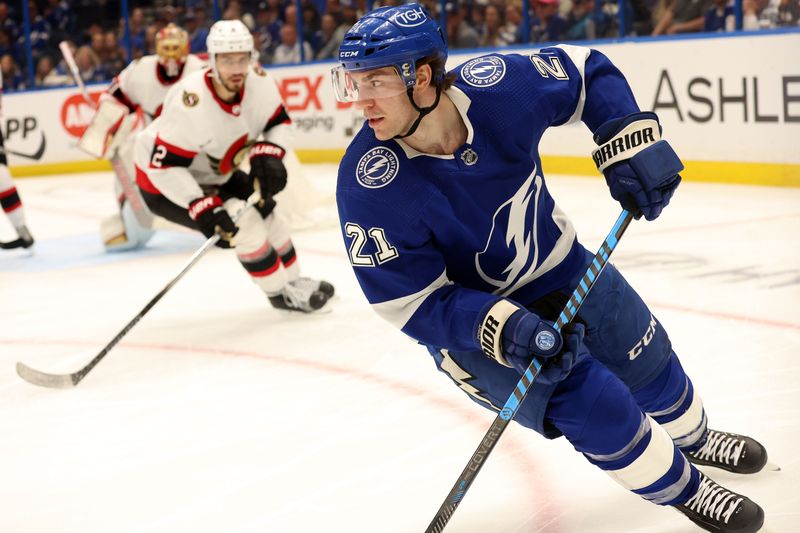 Apr 11, 2024; Tampa, Florida, USA; Tampa Bay Lightning center Brayden Point (21) skates with the puck against the Ottawa Senators during the third period at Amalie Arena. Mandatory Credit: Kim Klement Neitzel-USA TODAY Sports