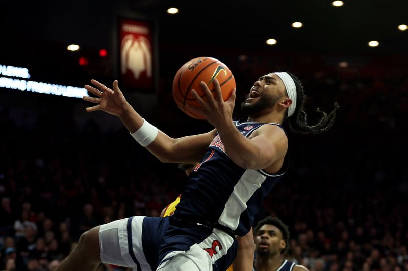 Jan 17, 2024; Tucson, Arizona, USA; Arizona Wildcats guard Kylan Boswell (4) shoots a basket against the USC Trojans during the second half at McKale Center. Mandatory Credit: Zachary BonDurant-USA TODAY Sports