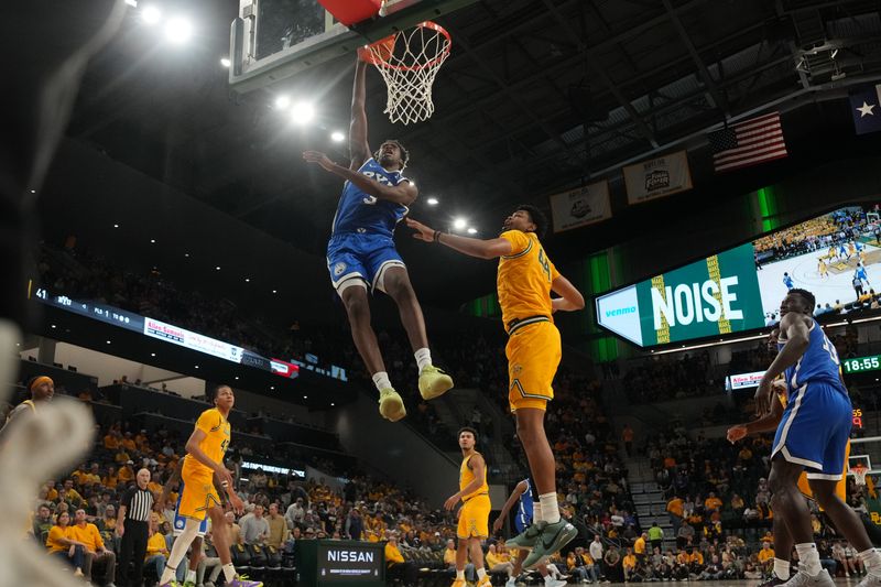 Feb 10, 2026; Waco, Texas, USA;  BYU Cougars forward AJ Dybantsa (3) dunks the ball against Baylor Bears center Caden Powell (44) during the second half at Paul and Alejandra Foster Pavilion. Mandatory Credit: Chris Jones-Imagn Images