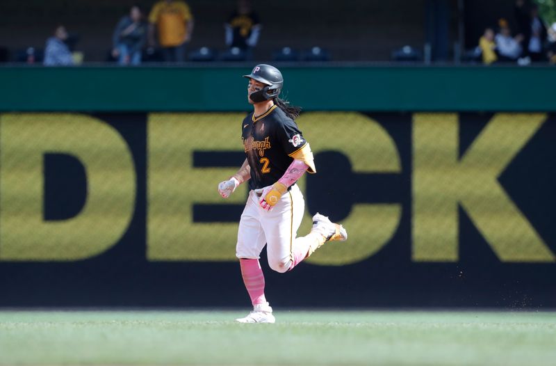 May 12, 2024; Pittsburgh, Pennsylvania, USA;  Pittsburgh Pirates right fielder Connor Joe (2) circles the bases on a two run home run against the Chicago Cubs during the tenth inning at PNC Park. The Cubs won 5-4 in ten innings. Mandatory Credit: Charles LeClaire-USA TODAY Sports