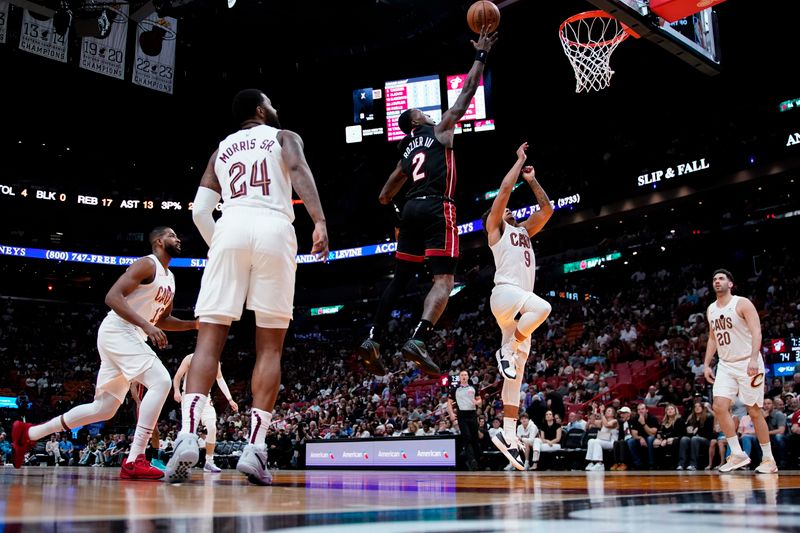 MIAMI, FLORIDA - MARCH 24: Terry Rozier #2 of the Miami Heat goes up for a shot against Craig Porter #9 of the Cleveland Cavaliers during the third quarter at Kaseya Center on March 24, 2024 in Miami, Florida. NOTE TO USER: User expressly acknowledges and agrees that, by downloading and or using this photograph, User is consenting to the terms and conditions of the Getty Images License Agreement. (Photo by Rich Storry/Getty Images)