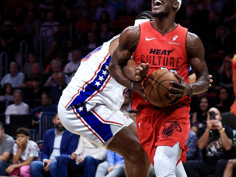 MIAMI, FLORIDA - NOVEMBER 18: Jimmy Butler #22 of the Miami Heat drives to the net ahead of Guerschon Yabusele #28 of the Philadelphia 76ers during the second half at Kaseya Center on November 18, 2024 in Miami, Florida. NOTE TO USER: User expressly acknowledges and agrees that, by downloading and or using this Photograph, user is consenting to the terms and conditions of the Getty Images License Agreement.  (Photo by Carmen Mandato/Getty Images)