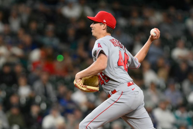 Sep 11, 2023; Seattle, Washington, USA; Los Angeles Angels relief pitcher Jimmy Herget (46) pitches to the Seattle Mariners during the eleventh inning at T-Mobile Park. Mandatory Credit: Steven Bisig-USA TODAY Sports