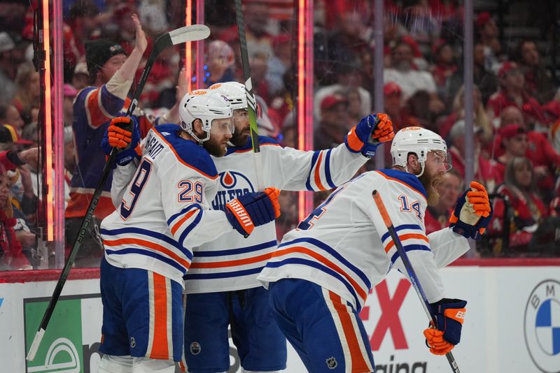 Jun 10, 2024; Sunrise, Florida, USA; Edmonton Oilers defenseman Mattias Ekholm (14) celebrates scoring against the Florida Panthers during the first period in game two of the 2024 Stanley Cup Final at Amerant Bank Arena. Mandatory Credit: Jim Rassol-USA TODAY Sports