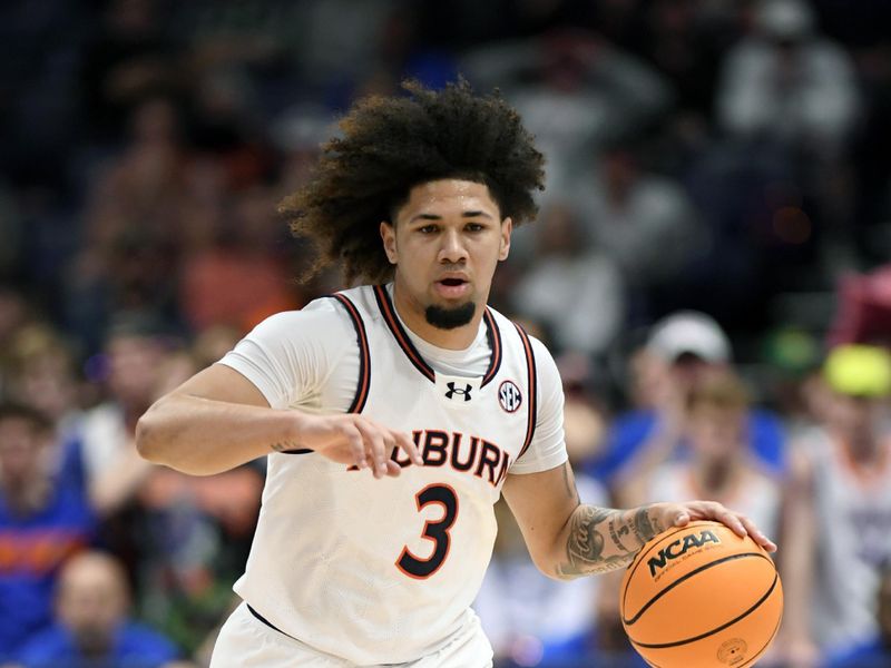 Mar 17, 2024; Nashville, TN, USA; Auburn Tigers guard Tre Donaldson (3) controls the ball in the second half against the Florida Gators in the SEC Tournament championship game at Bridgestone Arena. Mandatory Credit: Steve Roberts-USA TODAY Sports