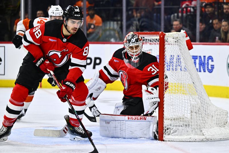 Apr 13, 2024; Philadelphia, Pennsylvania, USA; New Jersey Devils goalie Kaapo Kahkonen (31) defends the net against the Philadelphia Flyers in the first period at Wells Fargo Center. Mandatory Credit: Kyle Ross-USA TODAY Sports