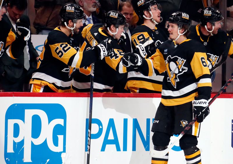 Feb 25, 2024; Pittsburgh, Pennsylvania, USA;  Pittsburgh Penguins right wing Rickard Rakell (67) celebrates his goal with the Pens bench against the Philadelphia Flyers during the third period at PPG Paints Arena.  Pittsburgh won 7-6. Mandatory Credit: Charles LeClaire-USA TODAY Sports