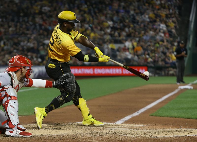 Aug 11, 2023; Pittsburgh, Pennsylvania, USA; Pittsburgh Pirates designated hitter Andrew McCutchen (22) hits an RBI single against the Cincinnati Reds during the sixth inning at PNC Park. Mandatory Credit: Charles LeClaire-USA TODAY Sports