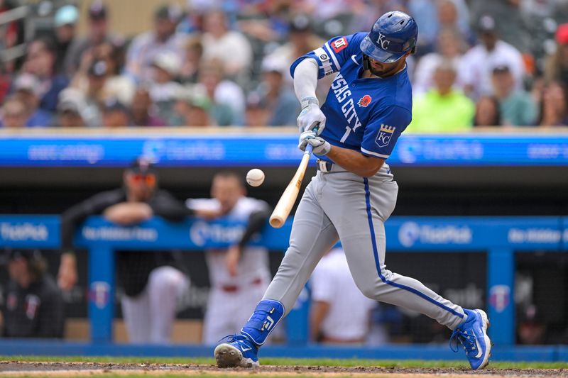 May 27, 2024; Minneapolis, Minnesota, USA; Kansas City Royals outfielder MJ Melendez (1) hits a single against the Minnesota Twins during the sixth inning at Target Field. Mandatory Credit: Nick Wosika-USA TODAY Sports