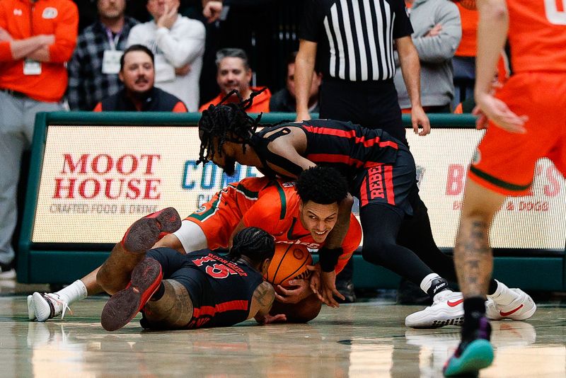 Jan 19, 2024; Fort Collins, Colorado, USA; Colorado State Rams guard Josiah Strong (3) battles for the ball with UNLV Rebels guard Luis Rodriguez (15) and forward Keylan Boone (20) in the first half at Moby Arena. Mandatory Credit: Isaiah J. Downing-USA TODAY Sports