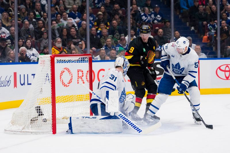 Jan 20, 2024; Vancouver, British Columbia, CAN; Toronto Maple Leafs defenseman Mark Giordano (55) watches as Vancouver Canucks forward J.T. Miller (9) scores on goalie Martin Jones (31) in the third period at Rogers Arena. Canucks won 6-4. Mandatory Credit: Bob Frid-USA TODAY Sports